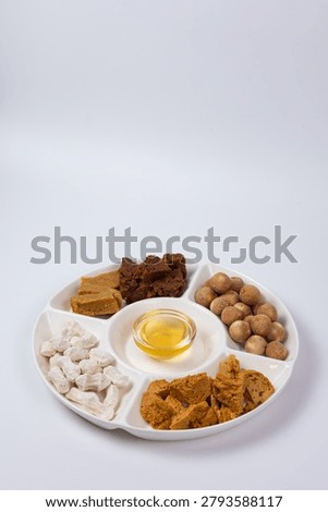 Top view flat lay of Central Asian traditional sweets and kurt cheese