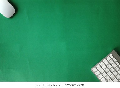 top view and flat lay copy space office green desk with keyboard and mouse