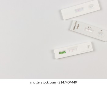 Top View Or Flat Lay Of Covid-19 Three Negative Test Result Antigen Test Kits (ATK)  On White  Background With Copy Space. Antigen Test Kits For Self Collect Nose Swab.