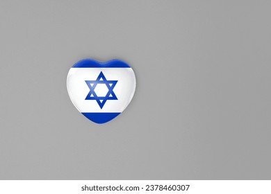 Top view or flat lay of heart with print of Israel flag on gray background with copy space. Flat lay. Copy space.