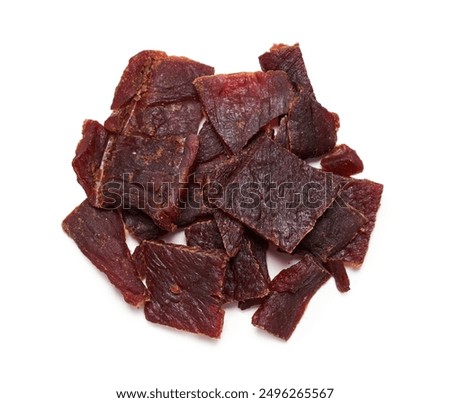 top view flat lay pile of beef jerky isolated on white background