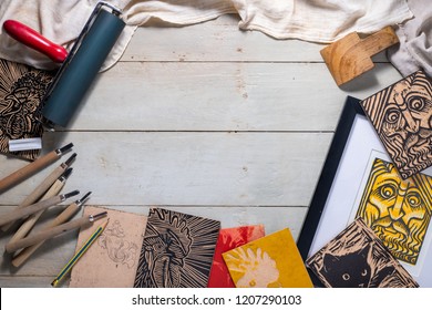 Top View Flat Lay Of Printmaking Tools For Woodcut Relief Print Arranged To Form A Picture Frame