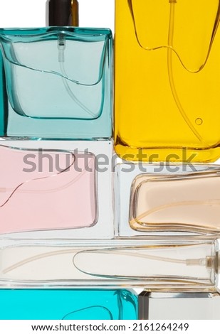 Top view, flat lay of a set of perfume bottles on a white blank background.