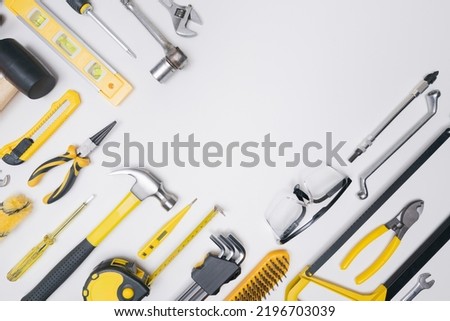 Top view flat lay set construction toolkit  safety protect industrial equipment gear on white background with empty space for craft diy build renovation,service maintenance repair in workshop concept.
