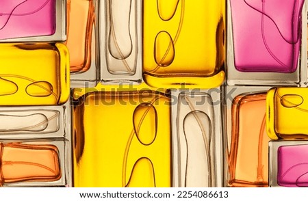Top view, flat lay of a set of perfume bottles on a on a colorful background