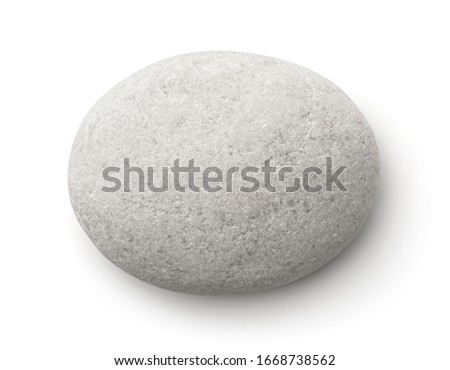 Top view of flat white pebble isolated on white