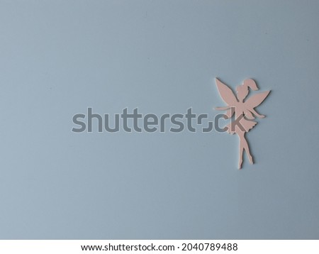 Top view flatlay lie concept view of little small Fairy, color background angel, background for children's party, fairy tale