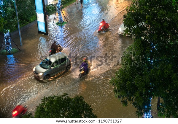 Top view of flooded traffic in a heavy rain in\
Hanoi, Vietnam