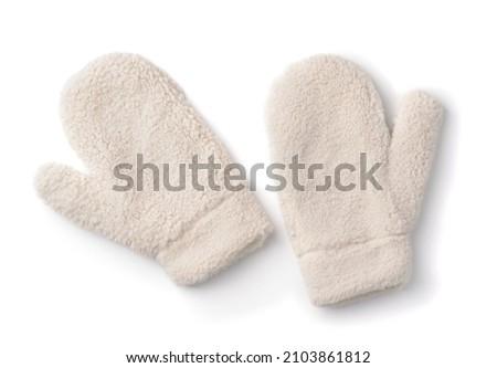 Top view of fluffy faux fur winter mittens isolated on white