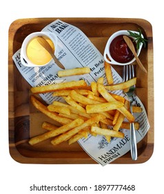 Top View Food French-fries Serve With Cheddar Cheese Dips And Ketchup On The Side With Paper On Wooden Tray And Table Isolated On White Background.