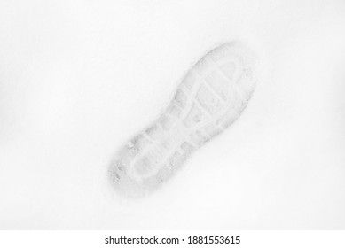Top view of the footprint of shoes boots on fresh snow. The winter season - Shutterstock ID 1881553615