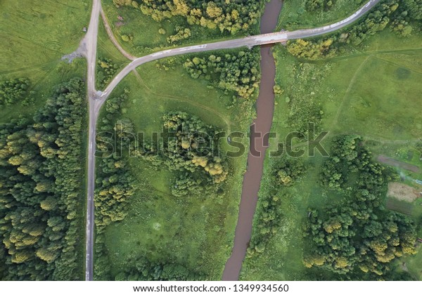 Top view of\
the forests, the river and the roads crossing them. Aerial\
photography and abstract plan for the\
earth