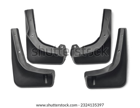 Top view of four new black car mudguard set isolated on white