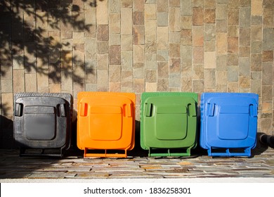 Top view four trash containers on the cement floor