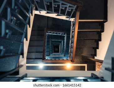 Top view, Frame square of vintage spiral staircase with light shiny in hotel - Powered by Shutterstock