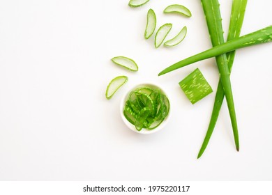 Top view of Fresh Aloe vera leaves and sliced in white bowl isolated on white background.