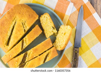 Top View Of Fresh Baked Cut Hatch Chili Pepper Cornbread On A Plate.