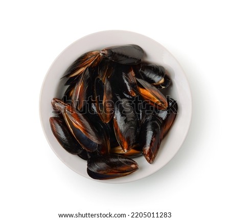 Top view of fresh boiled mussels in ceramic plate isolated on white