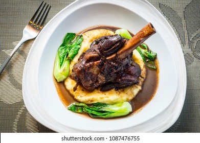 Top View For Fresh Lamb Shank On A Bed Of Mashed Potatoes, Vegetable