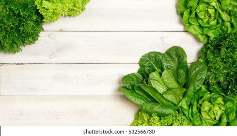 Top view of fresh Lettuce on wooden background.