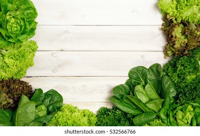 Top view of fresh Lettuce  on wooden background.