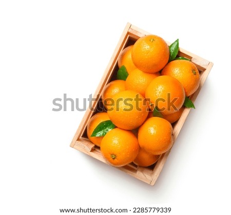 Top view of fresh oranges in wooden crate isolated on whitebackground. Clipping path.
