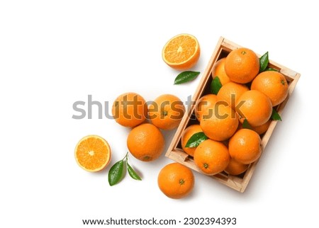 Top view of fresh oranges in wooden crate isolated on whitebackground.
