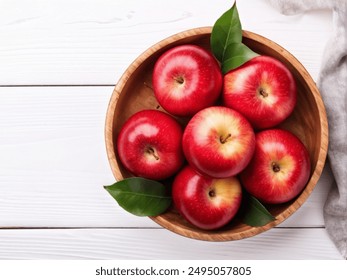 Top view of Fresh red apples. Close up of fresh red apples on wooden bowl on white wooden background. Copy space. - Powered by Shutterstock