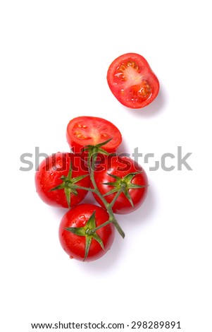 Top view of fresh tomatoes, whole and half cut, isolated on white background 