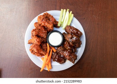 A Top View Of Fried Chicken And Veggie Sticks On A Plate