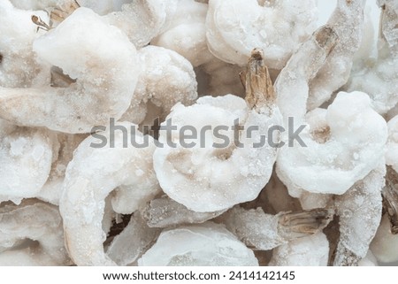Top view of frozen raw white shrimp peeled and deveined