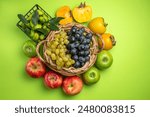 top view fruits basket of bunches of grapes persimmons apples basket of citrus fruits