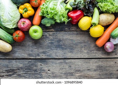 Top View Of Fruits And Vegetables On The Old Wood Table With Copy Space