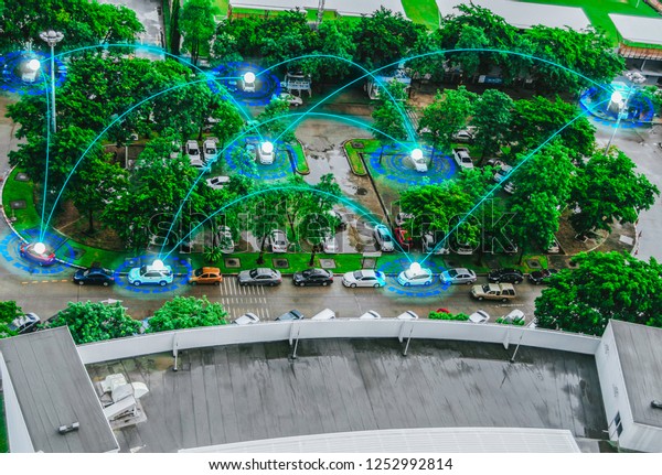 Top view futuristic user interface\
graphic, intelligent vehicle control Sensing system GPS real time\
car park communication network,future concept and comfort from IOT\
(internet of\
things)technology