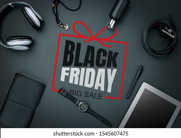 Top view of gadgets with black friday lettering on black background. Copyspace for your ad. Black friday, sales, finance, advertising, money, finance, purchases concept. Headphone, watch, tablet.