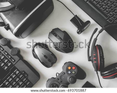 top view of gaming gear, gamer space concept, with mouse, keyboard, headset, joystick, webcam, VR Headset on white background