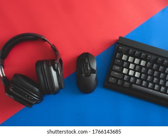 Top View A Gaming Gear, Mouse, Keyboard, Headset, Headphone On Table Background.