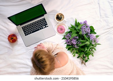 Top View Girl Working At Laptop Morning Coffee Donut Bouquet Lilac Red Apple Green Screen