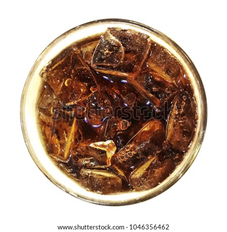 Top view of a glass of cola on white background, selective focus.