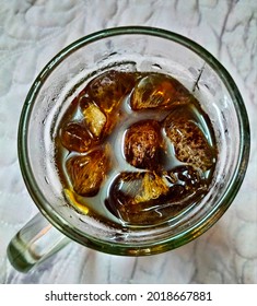 Top View Of A Glass Of Cold Soft Drinks, Cola, Coffee, Tea, Soda, Beverages With Ice Cubes.