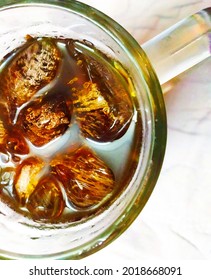 Top View Of A Glass Of Cold Soft Drinks, Cola, Coffee, Tea, Soda, Beverages With Ice Cubes.