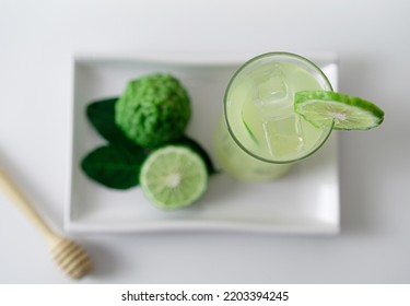 Top View A Glass Of Fresh Bergamot Juice On White Tray