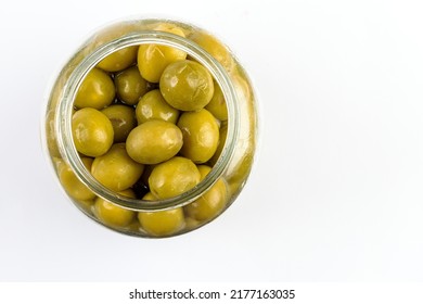 Top view of glass jar with green olives. - Powered by Shutterstock