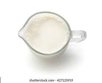 Top View Of Glass Milk Jug With Milk On The White