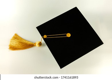 Top View Of Graduation Cap Place On  The  White Background