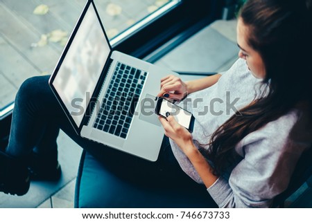 Top view graphic designer checking email in website during remote work on laptop computer with mock up copy space screen. Female network user holding modern devices browsing blog website on netbook