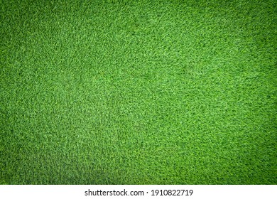 Top view of green artificial grass texture and background. Artificial turf grass for decorative in the garden, football field and golf course. Green backdrop and wallpaper. Copy space for your text. - Shutterstock ID 1910822719