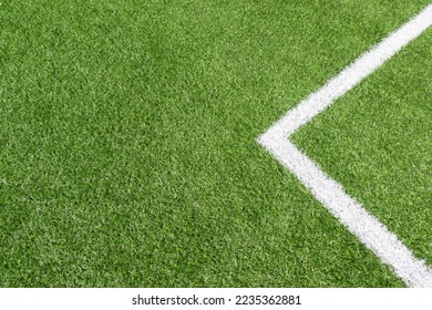 Top view to green artificial soccer football field grass with white line - Powered by Shutterstock