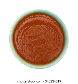 Top View Of A Green Bowl With Canned Spaghetti Sauce Isolated On A White Background.