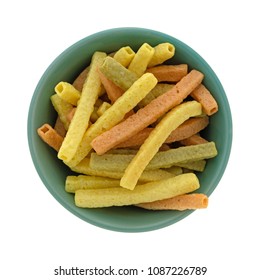 Top View Of A Green Bowl Filled Veggie Straws Isolated On A White Background.